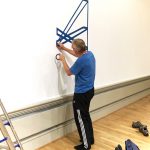 Tim installing his foodbank graphic